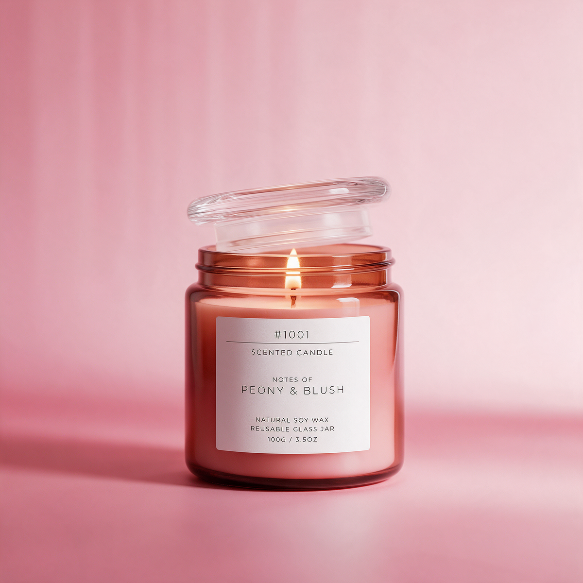 Lit candle in an amber glass jar labeled #1001