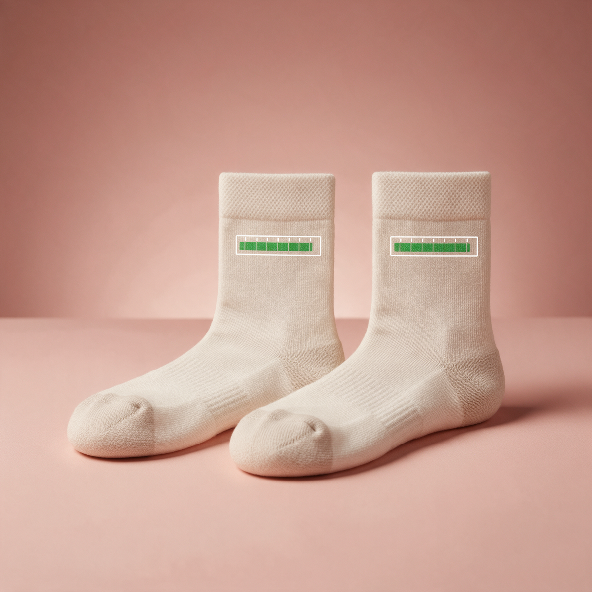 Off-white crew socks with a green progress bar on the cuff